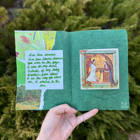 An art journal spread. The background is a collage of green paper. A Medieval painting of a woman kneeling before an angel is on the right page. On the left page are lyrics to the song 'BITTERSUITE' by Billie Eilish in green script.