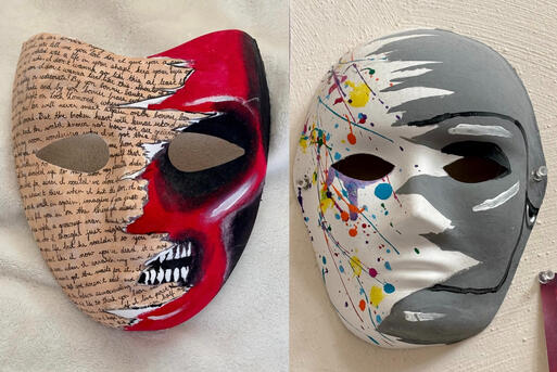 Two masks side by side, each one with half its face painted differently. The left side of the left mask is painted a tan color with lyrics to many different songs written in small black script. The left mask's right side is painted like a red human skull.